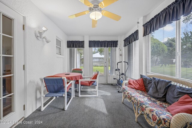 sunroom / solarium with ceiling fan