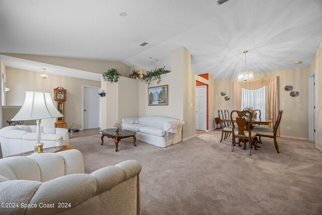 carpeted living room featuring vaulted ceiling and a chandelier