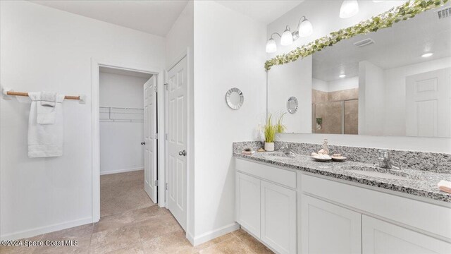 bathroom featuring vanity and walk in shower