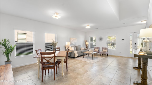 tiled dining room with plenty of natural light