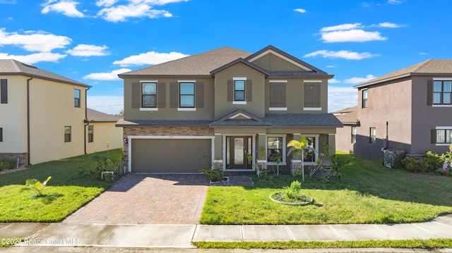 view of front facade featuring a garage and a front lawn