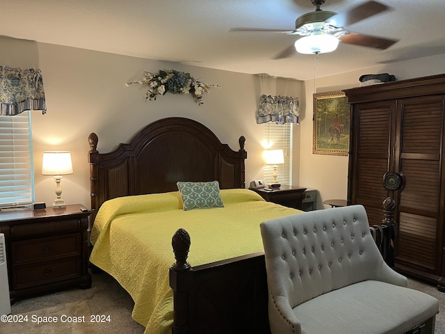 bedroom featuring ceiling fan and light colored carpet