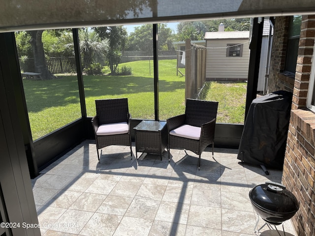 sunroom / solarium featuring plenty of natural light