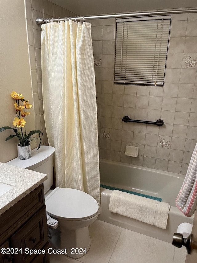 full bathroom featuring vanity, toilet, tile patterned floors, and shower / bath combo with shower curtain