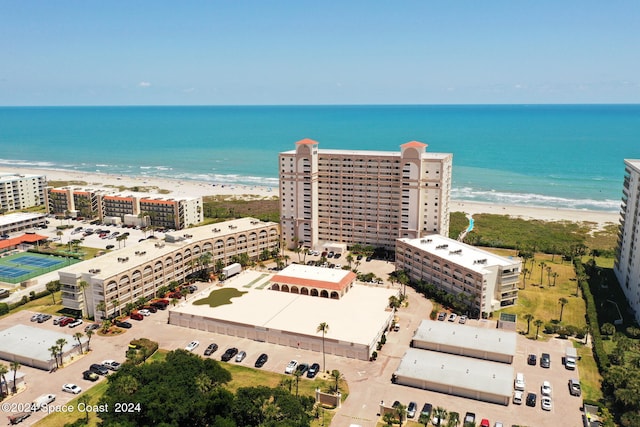 birds eye view of property with a view of the beach and a water view