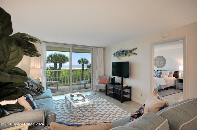 tiled living room featuring expansive windows