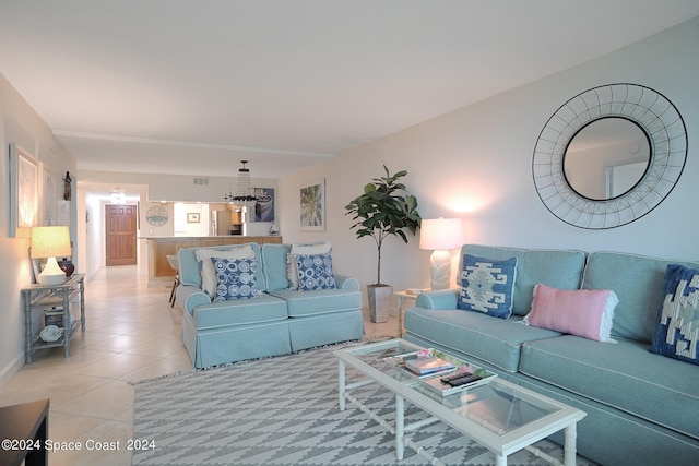 living area featuring visible vents and light tile patterned floors