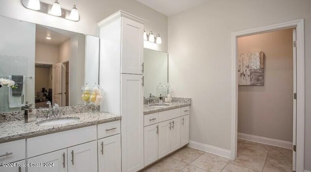 bathroom featuring vanity and tile patterned flooring