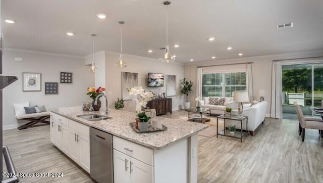 kitchen with sink, white cabinetry, a center island with sink, dishwasher, and pendant lighting