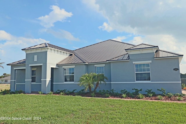 view of front of home with a front yard