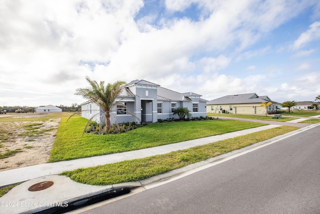 view of front facade featuring a garage and a front yard