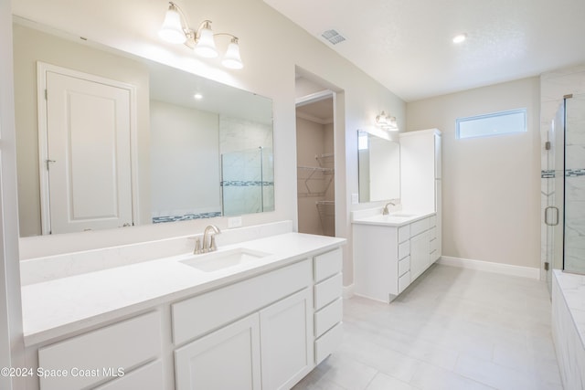 bathroom featuring vanity and a shower with shower door