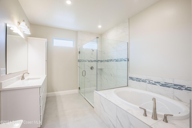 bathroom with tile patterned flooring, vanity, and independent shower and bath