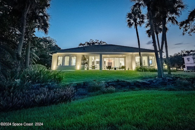 view of front of property with a yard