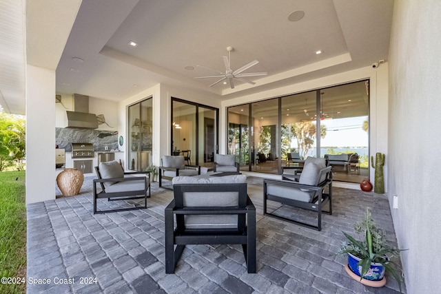 view of patio with ceiling fan, grilling area, and an outdoor hangout area