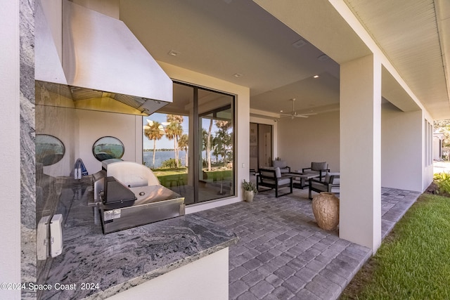 view of patio featuring ceiling fan