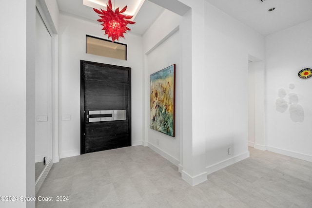 foyer entrance featuring light tile patterned floors