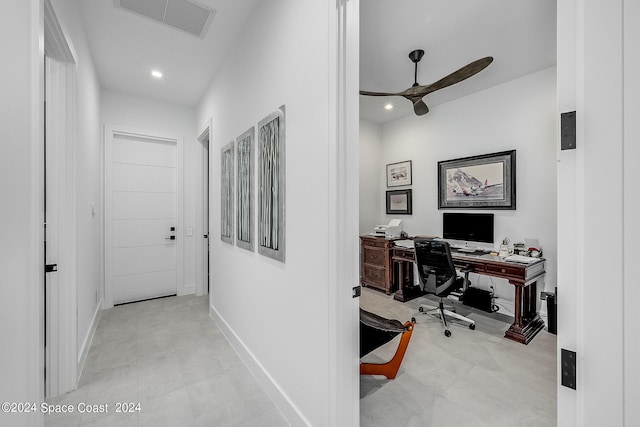 tiled home office featuring ceiling fan