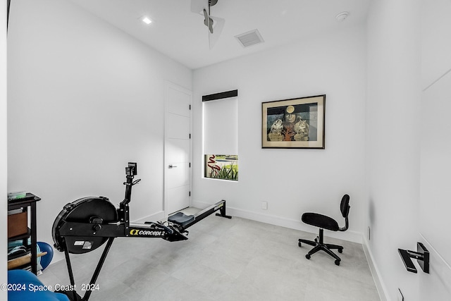 workout area featuring light tile patterned flooring