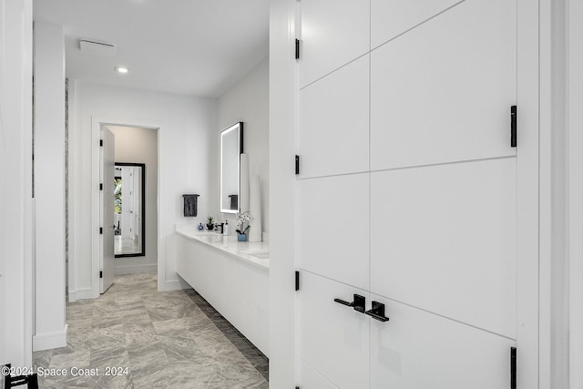 interior space featuring tile patterned floors and sink