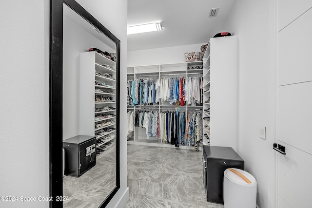 spacious closet with tile patterned flooring