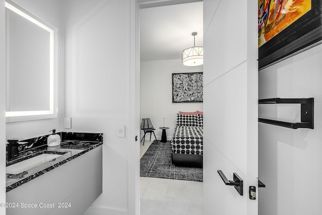 bathroom with sink and tile patterned flooring