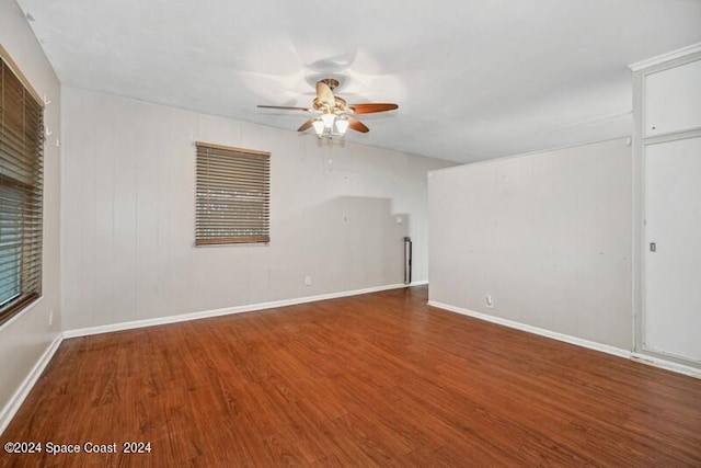 spare room with ceiling fan and hardwood / wood-style flooring