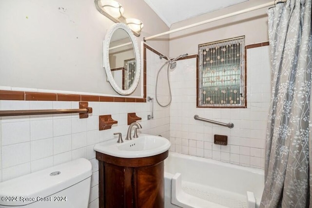 full bathroom featuring toilet, vanity, tasteful backsplash, shower / bathtub combination with curtain, and tile walls