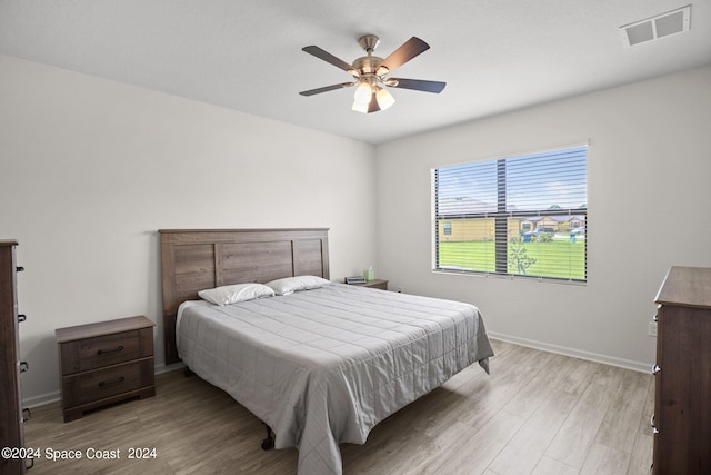 bedroom featuring light hardwood / wood-style flooring and ceiling fan