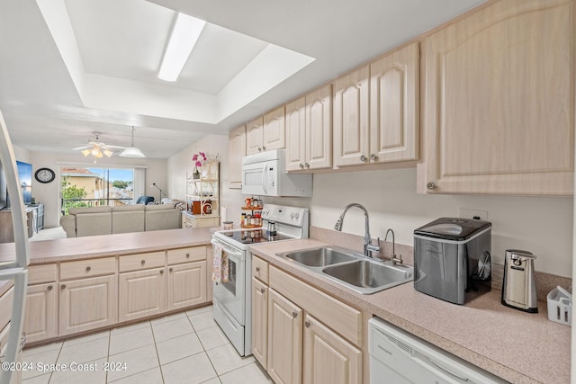 kitchen featuring ceiling fan, light brown cabinetry, light tile patterned floors, sink, and stove