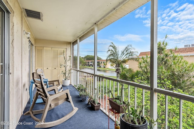 balcony featuring a water view