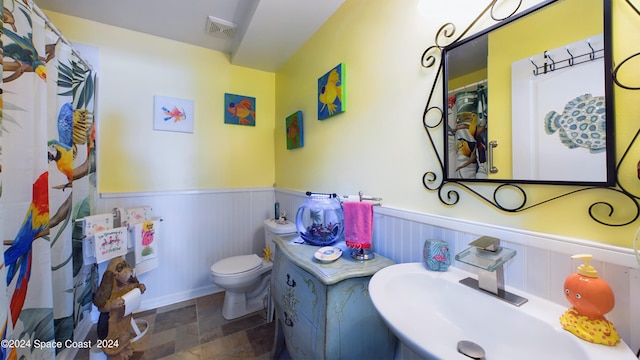 bathroom with sink and toilet