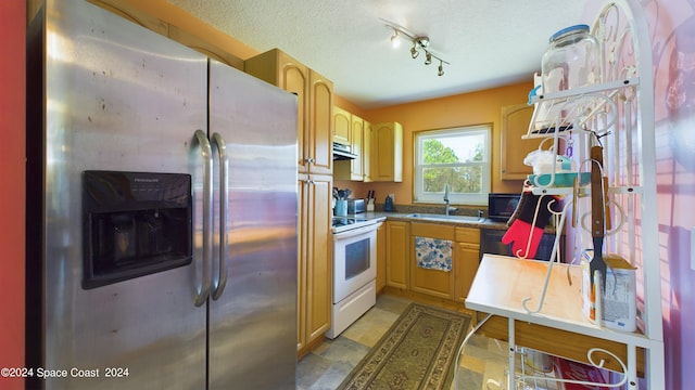 kitchen featuring light brown cabinets, sink, a textured ceiling, stainless steel fridge with ice dispenser, and white range with electric stovetop