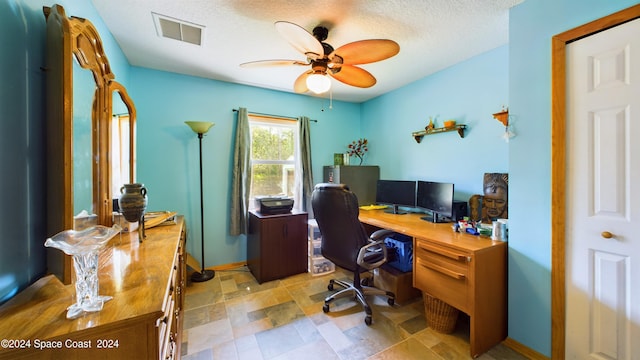 office space featuring a textured ceiling and ceiling fan