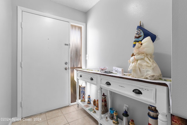 entryway featuring light tile patterned floors