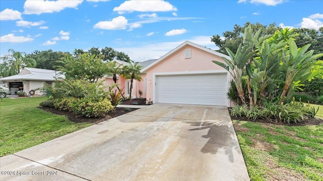 view of front of house with a front lawn and a garage