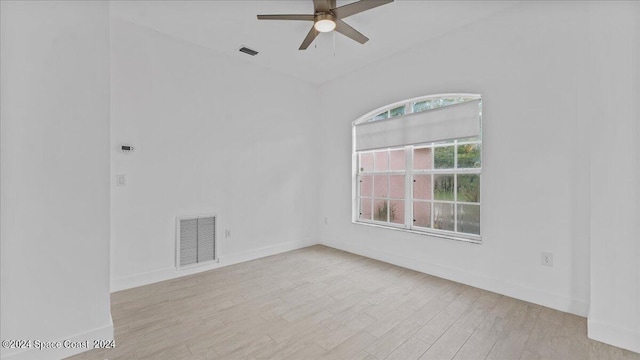 empty room with light wood-type flooring and ceiling fan