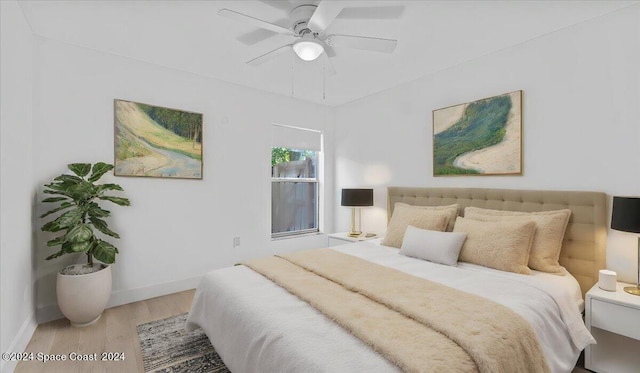 bedroom featuring ceiling fan and light hardwood / wood-style floors