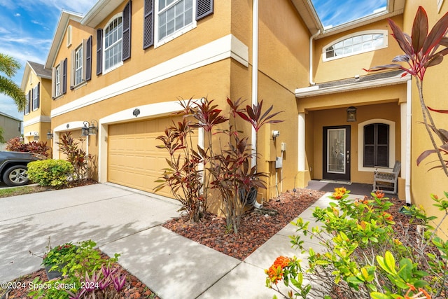 doorway to property featuring a garage