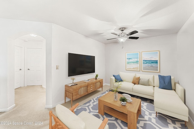 living room featuring light carpet and ceiling fan