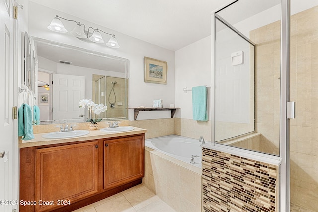 bathroom featuring vanity, independent shower and bath, and tile patterned flooring