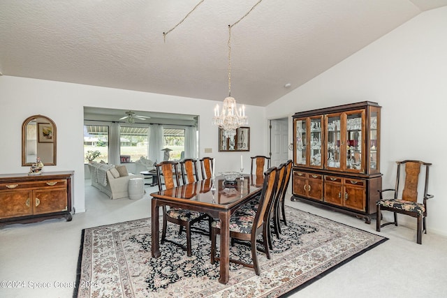 carpeted dining room featuring lofted ceiling, a notable chandelier, and a textured ceiling