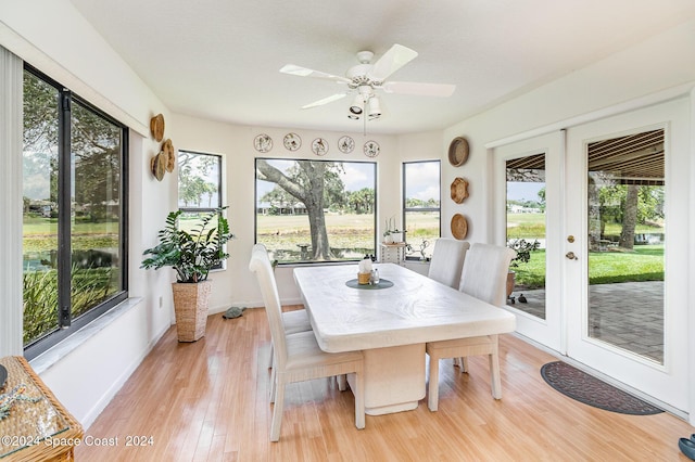 sunroom with french doors and a ceiling fan