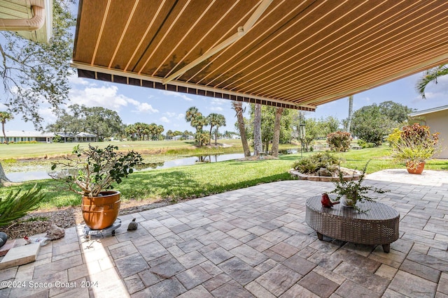 view of patio / terrace with a water view