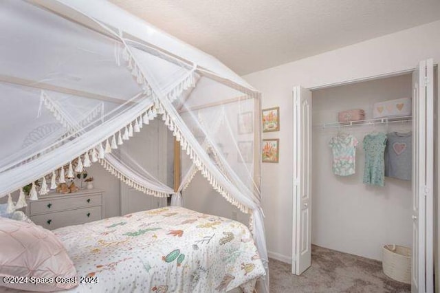 carpeted bedroom with a closet