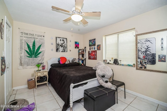 tiled bedroom with ceiling fan