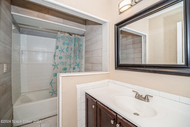 bathroom featuring shower / bath combo and vanity