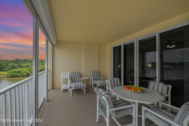 view of balcony at dusk