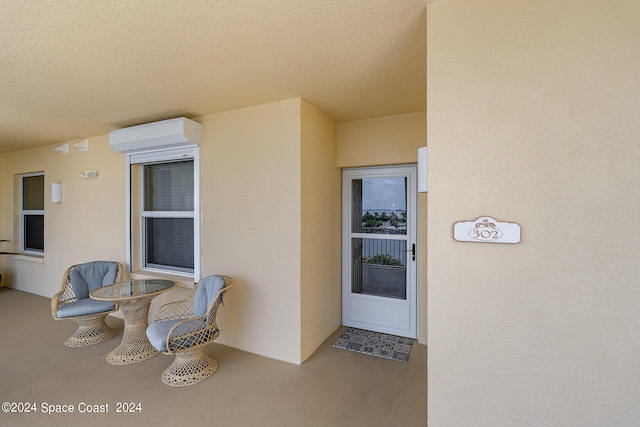 entrance to property featuring a wall mounted air conditioner