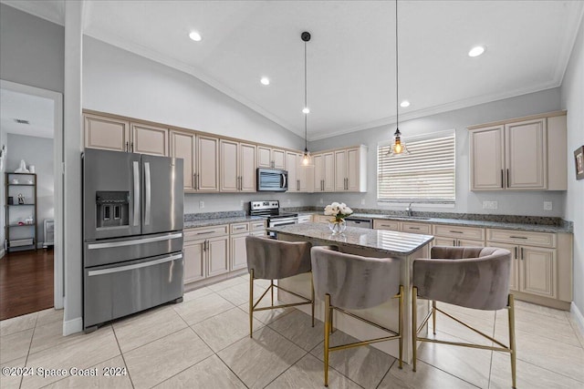 kitchen with light wood-type flooring, a kitchen island, crown molding, and stainless steel appliances